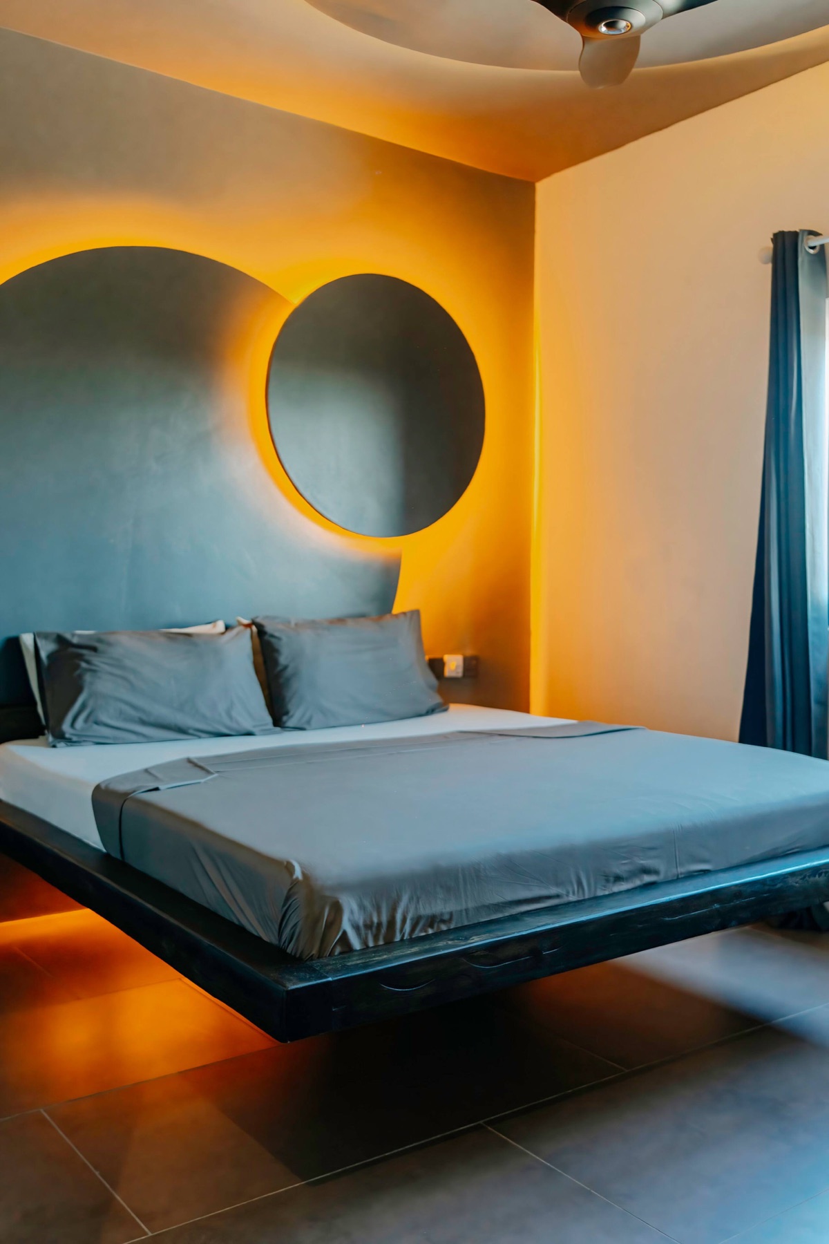 The teal-and-oak bedroom